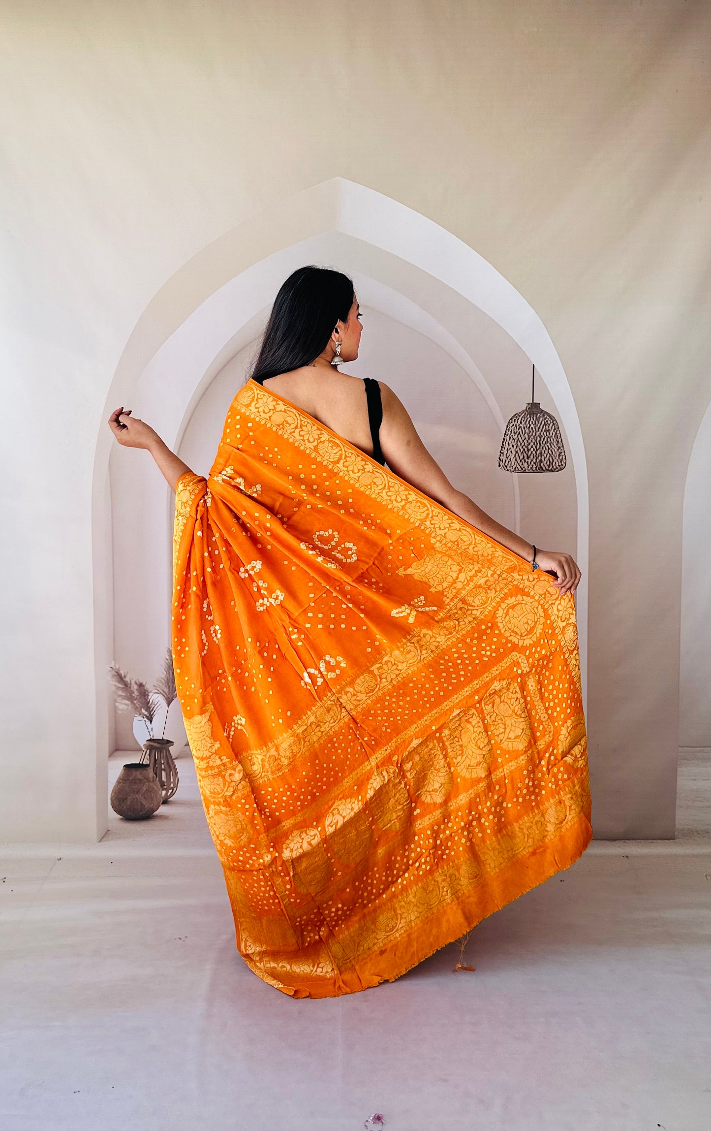 Enchanting Weaves Yellow bandhani saree