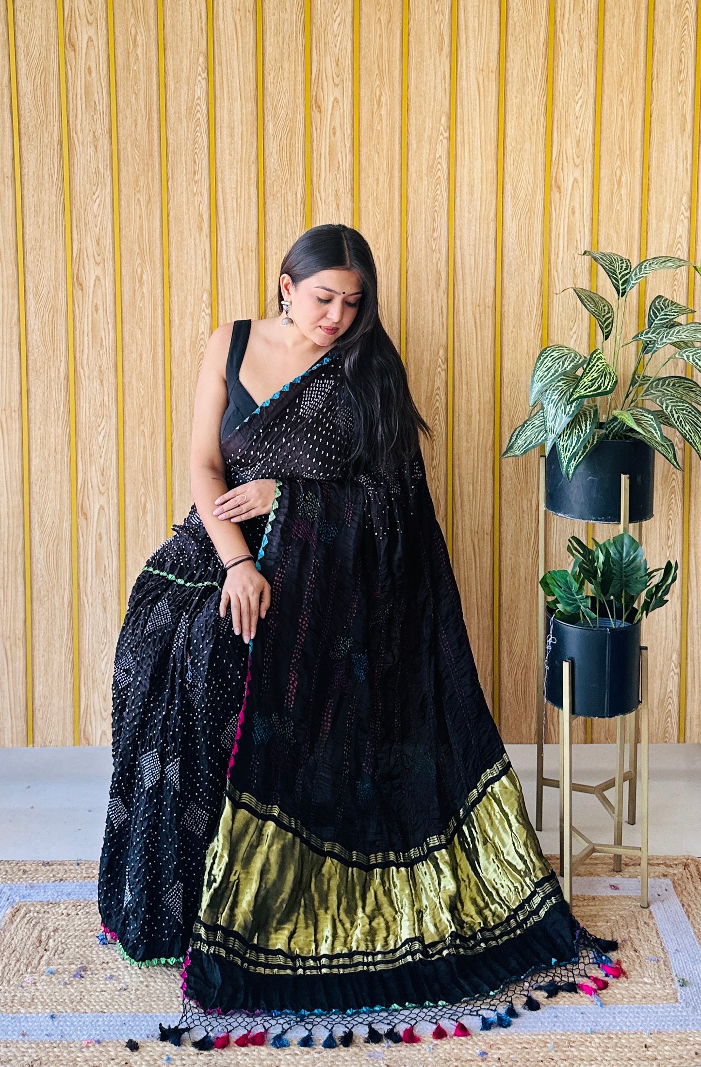 Bold black multi colour motifs bandhani saree