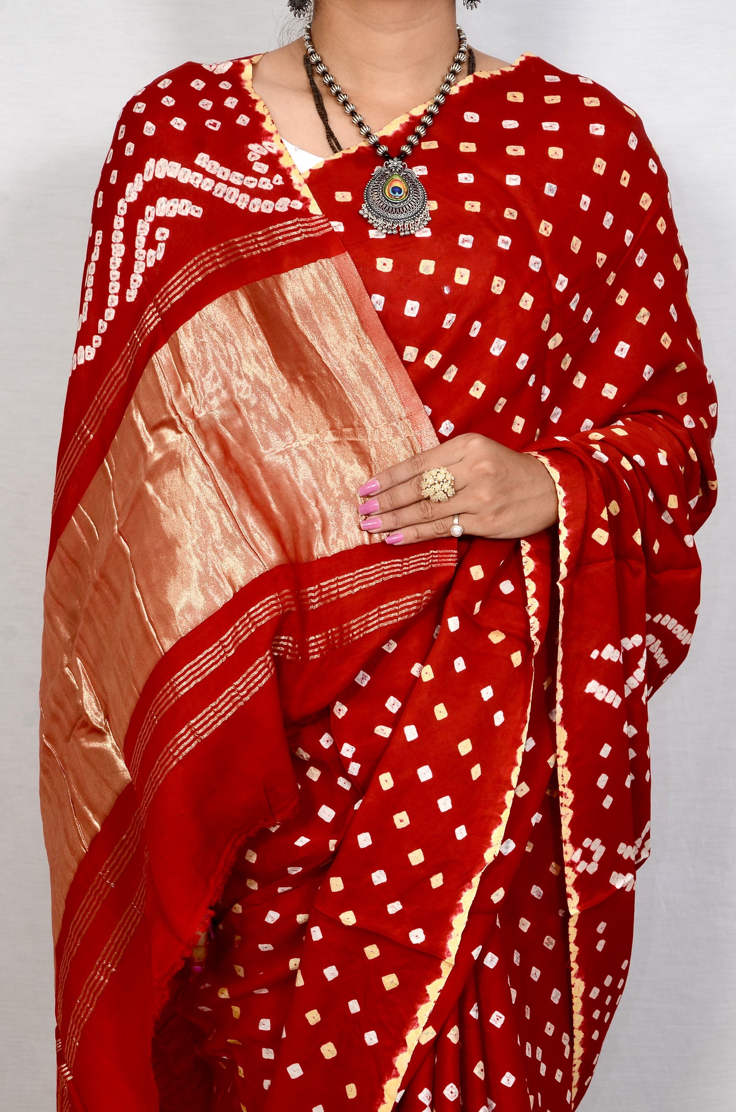 Red dani saree with edges