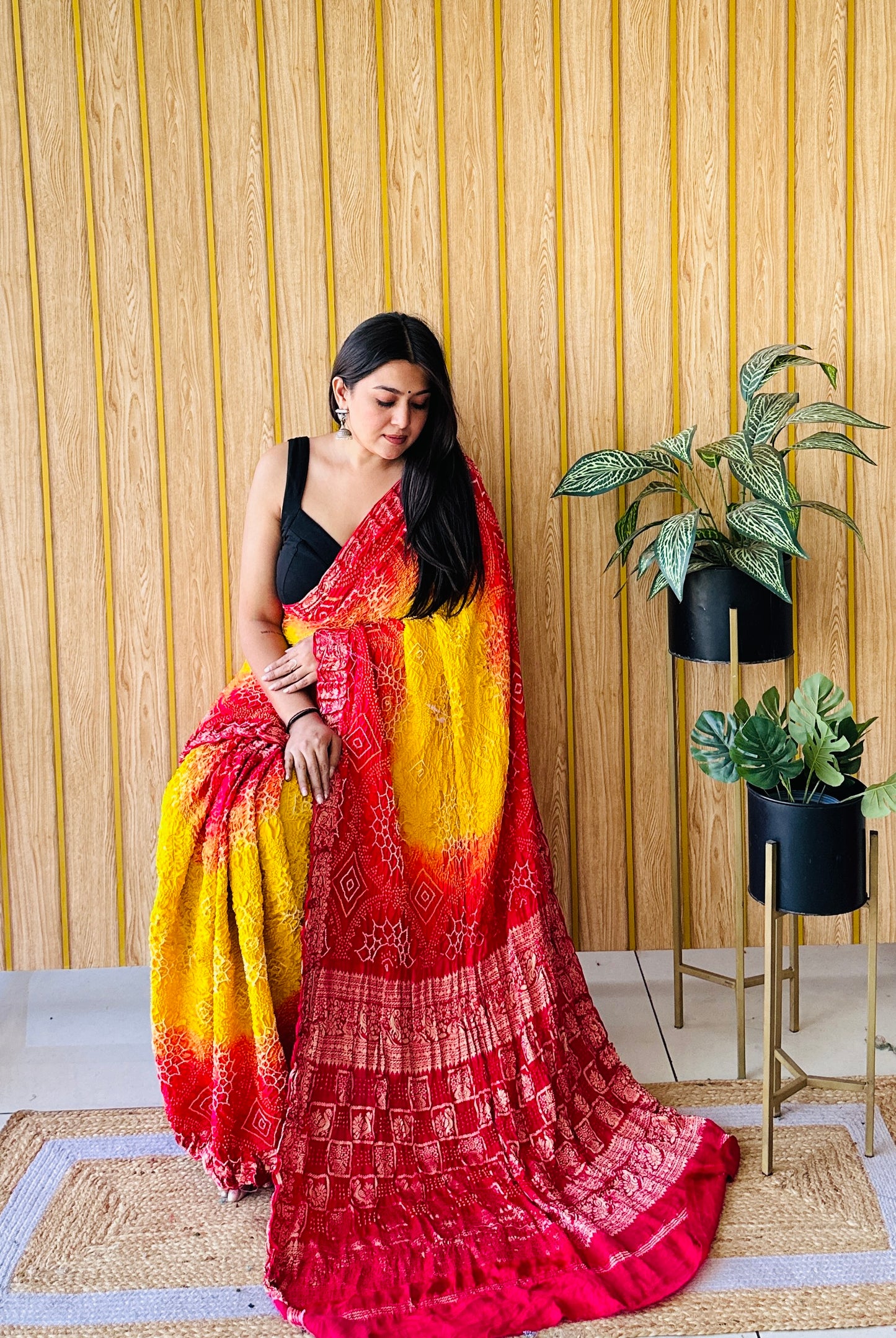 Graceful glimmer yellow and red bandhani saree