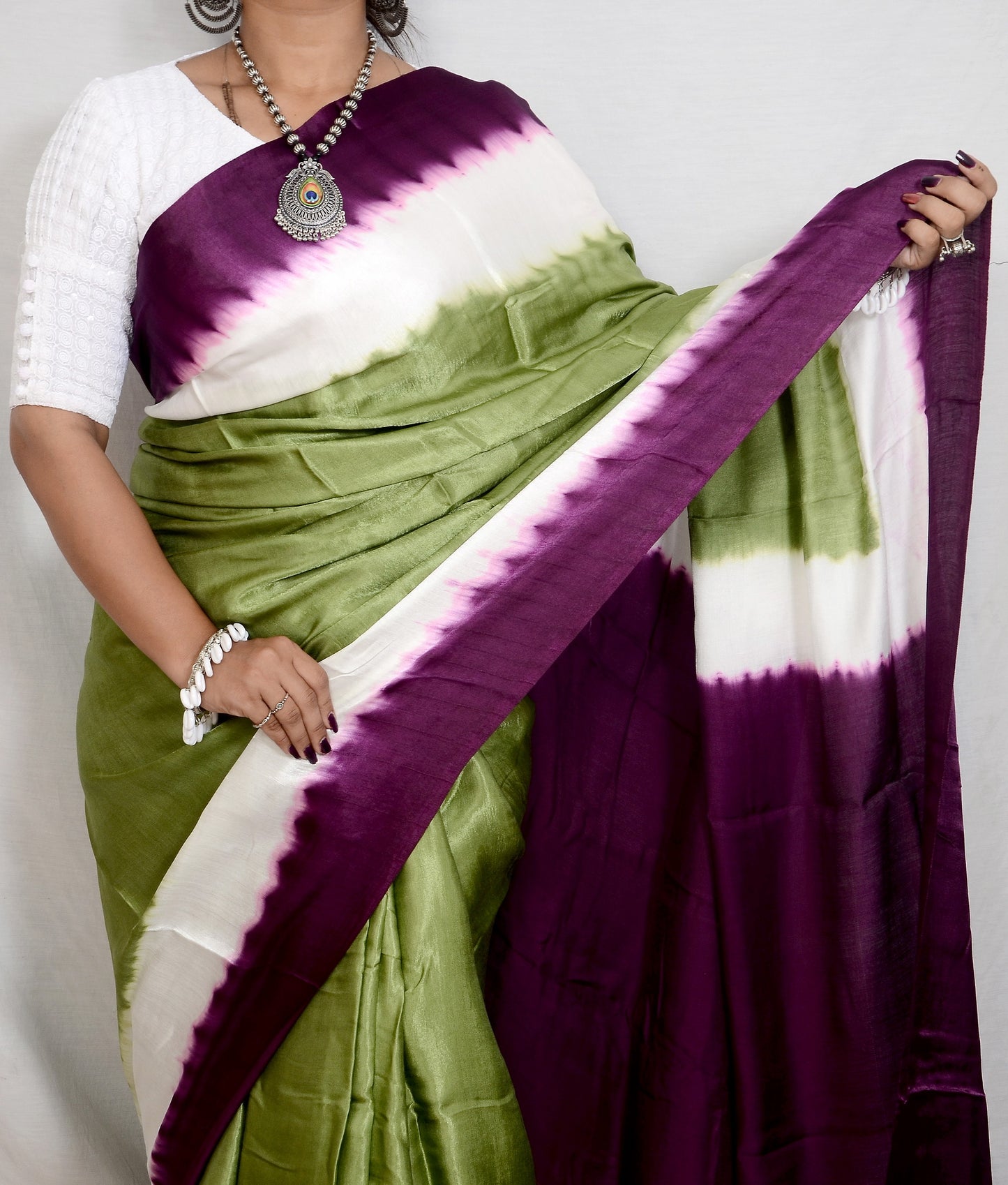 Ornate Legacy Green and Purple Modal Saree